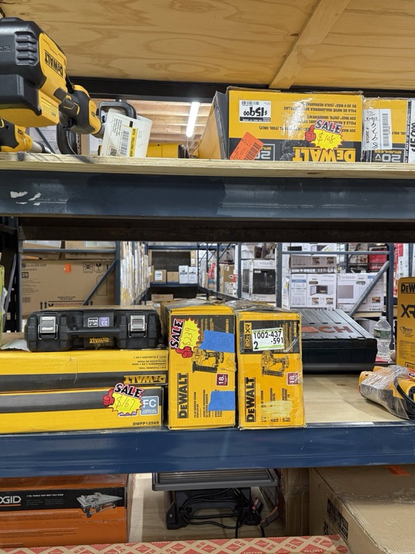 DeWalt yellow boxed power tools and combo kits on warehouse shelving at 789 Home Outlet