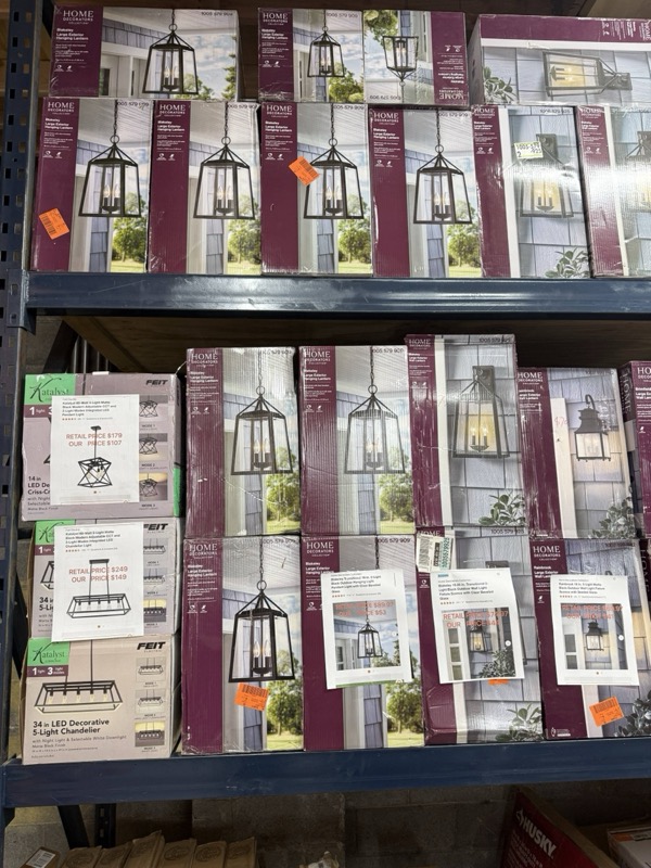 Home Decorators outdoor lantern pendants in original boxes stacked on warehouse shelving